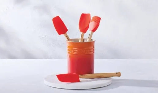 Le Creuset pot with 3 utensils